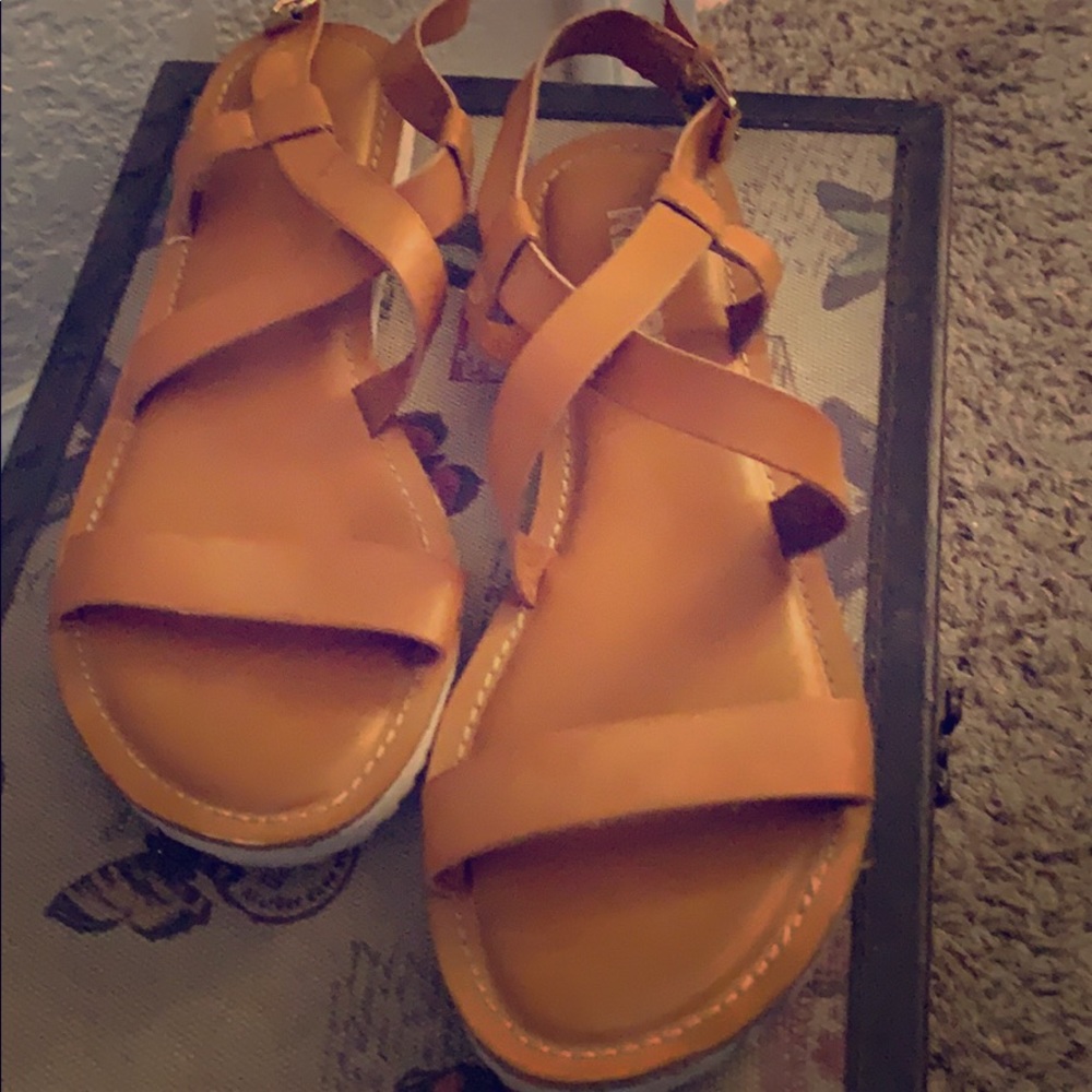Tan sandals.